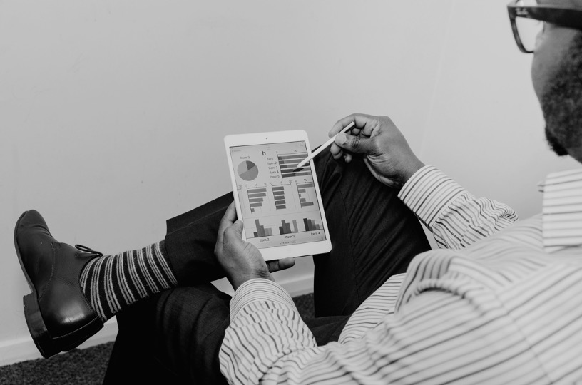 Man Reviewing Analytics on iPad