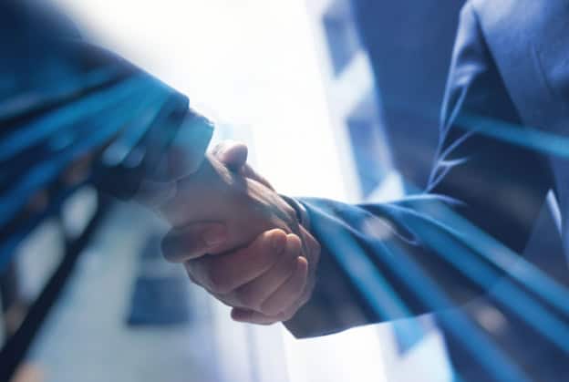 Business professionals shaking hands