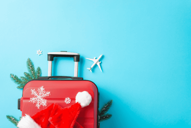 Holiday travel suitcase blue background